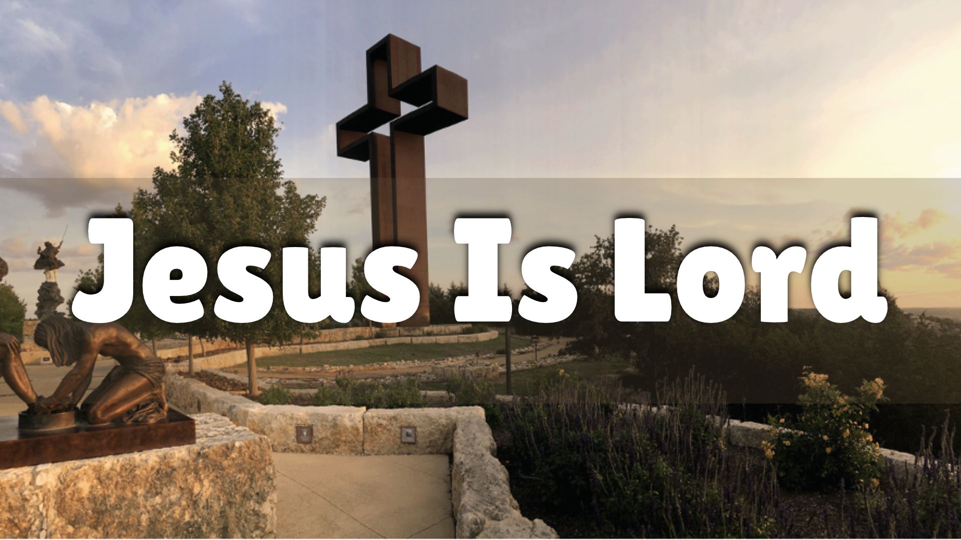 Jesus Is Lord over a garden scene with a cross